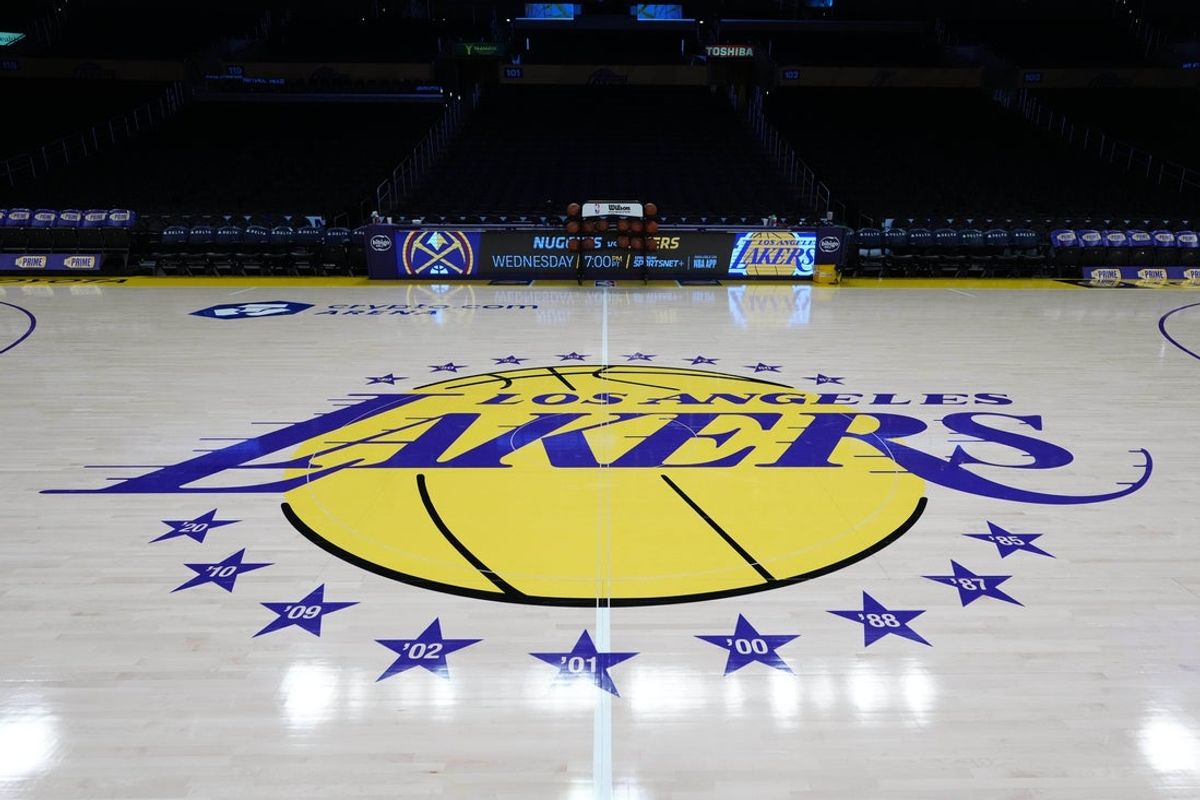 Mar 17, 2025; Los Angeles, California, USA; The Los Angeles Lakers logo at midcourt at Crypto.com Arena. Mandatory Credit: Kirby Lee-Imagn Images