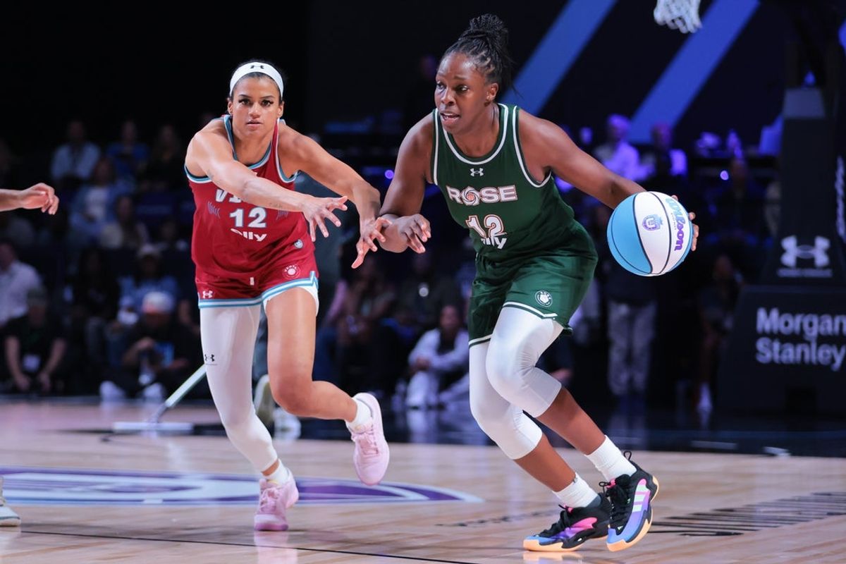 Mar 17, 2025; Miami, FL, USA; Rose BC guard Chelsea Gray (12) dribbles the basket past Vinyl BC guard Rae Burrell (12) during the fourth quarter of the Unrivaled Championship game at Wayfair Arena. Mandatory Credit: Sam Navarro-Imagn Images
