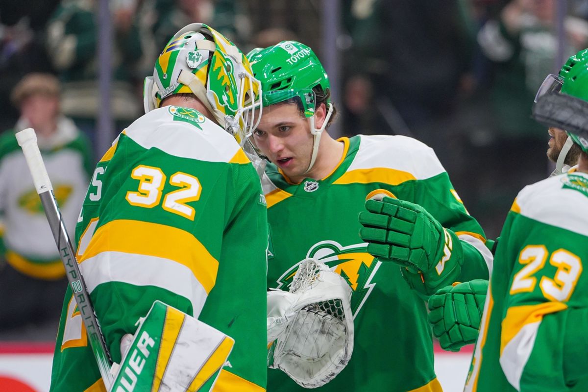 Mar 17, 2025; Saint Paul, Minnesota, USA;  Minnesota Wild defenseman Brock Faber (7) celebrates with goaltender Filip Gustavsson (32) after the game against the Los Angeles Kings at Xcel Energy Center. Mandatory Credit: Brad Rempel-Imagn Images