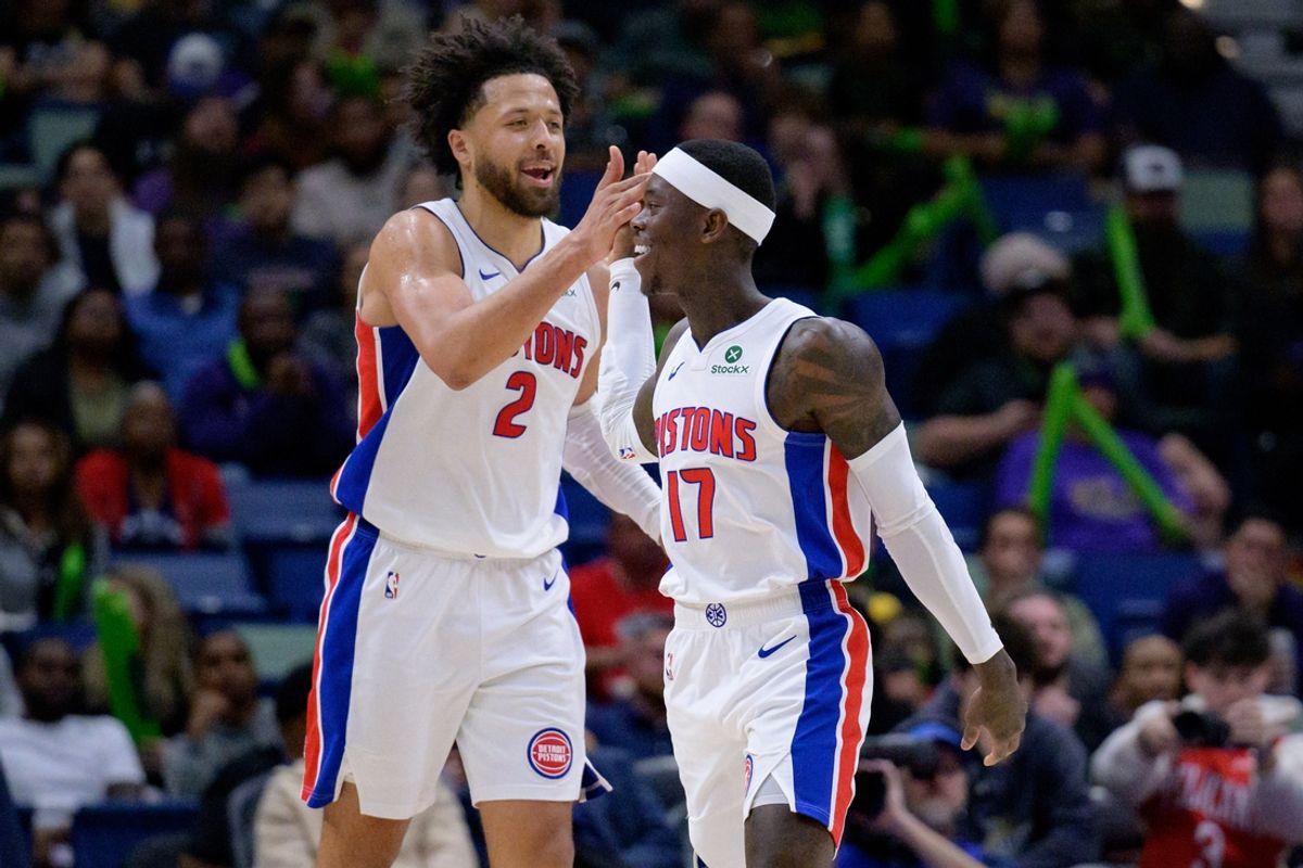 Mar 17, 2025; New Orleans, Louisiana, USA;  Detroit Pistons guard Cade Cunningham (2) celebrates a basket with guard Dennis Schroder (17) against the New Orleans Pelicans during the second half at Smoothie King Center. Mandatory Credit: Matthew Hinton-Imagn Images