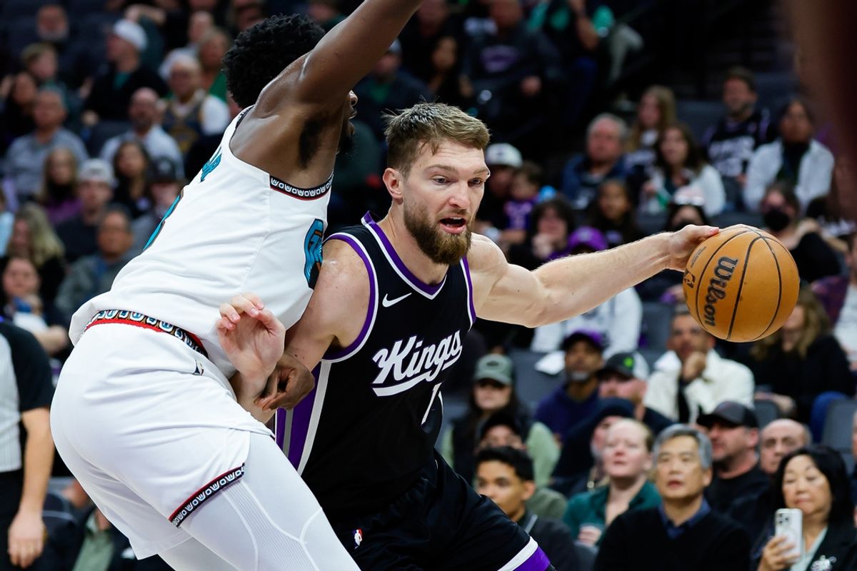 Mar 17, 2025; Sacramento, California, USA; Sacramento Kings forward Domantas Sabonis (11) dribbles the ball against Memphis Grizzlies forward Jaren Jackson Jr. (13) during the second quarter at Golden 1 Center. Mandatory Credit: Sergio Estrada-Imagn Images