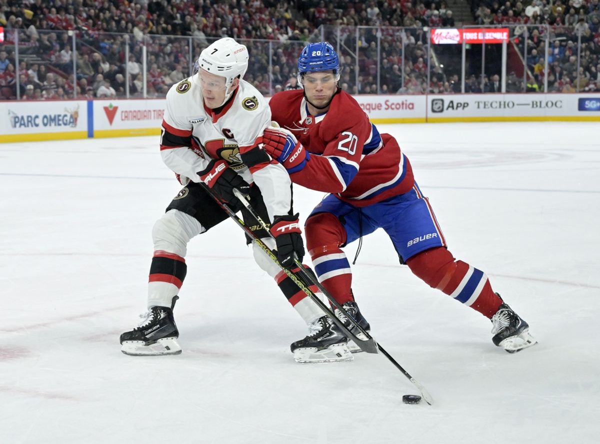 Mar 18, 2025; Montreal, Quebec, CAN; Ottawa Senators forward Brady Tkachuk (7) plays the puck and Montreal Canadiens forward Juraj Slafkovsky (20) defends during the first period at the Bell Centre. Mandatory Credit: Eric Bolte-Imagn Images