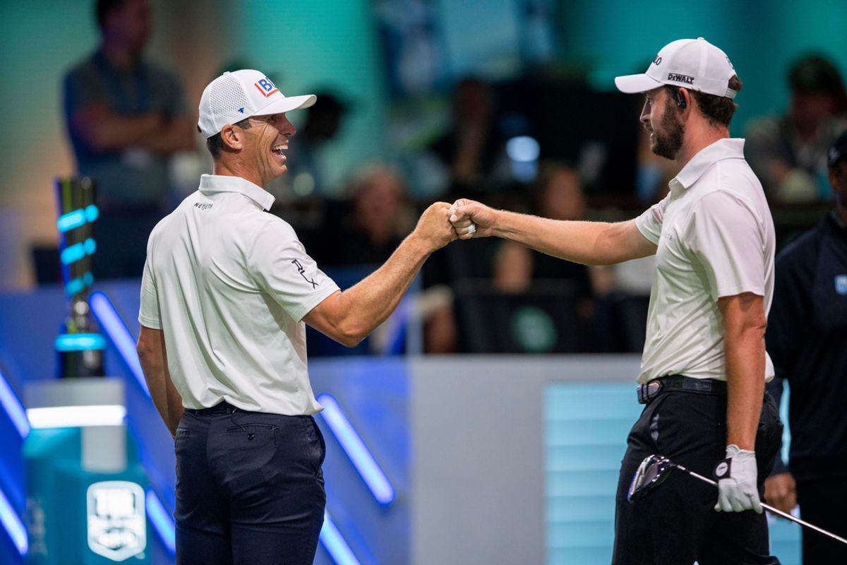 Billy Horschel fist bumps Patrick Cantlay after his tee shot for Atlanta Drive GC against Bay Golf Club in the TGL semifinal match at SoFi Center on March 18, 2025, in Palm Beach Gardens, Florida.