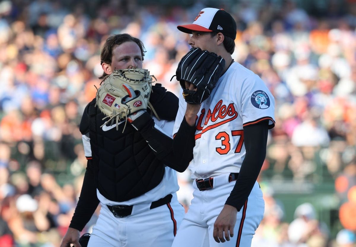 Mar 18, 2025; Sarasota, Florida, USA; Baltimore Orioles starting pitcher Cade Povich (37) and catcher Adley Rutschman (35) talk at the end of the top of the first inning against the Toronto Blue Jays at Ed Smith Stadium. Mandatory Credit: Kim Klement Neitzel-Imagn Images