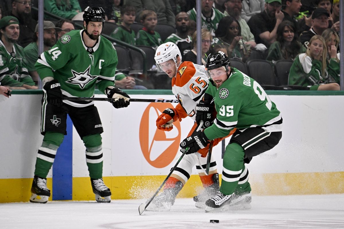 Mar 18, 2025; Dallas, Texas, USA; Anaheim Ducks defenseman Jacob Trouba (65) and Dallas Stars center Matt Duchene (95) chase the puck as left wing Jamie Benn (14) looks on during the first period at the American Airlines Center. Mandatory Credit: Jerome Miron-Imagn Images