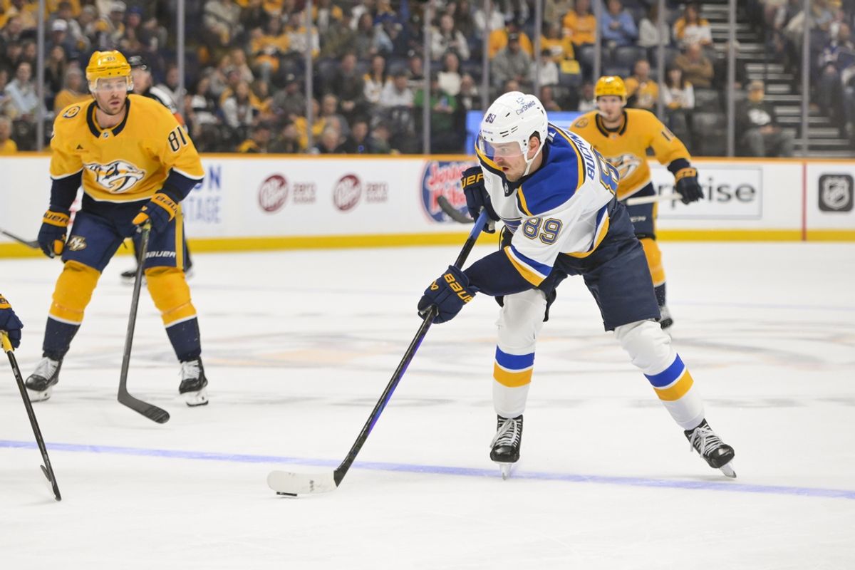 Mar 18, 2025; Nashville, Tennessee, USA;  St. Louis Blues left wing Pavel Buchnevich (89) takes a shot on goal against the Nashville Predators during the first period at Bridgestone Arena. Mandatory Credit: Steve Roberts-Imagn Images