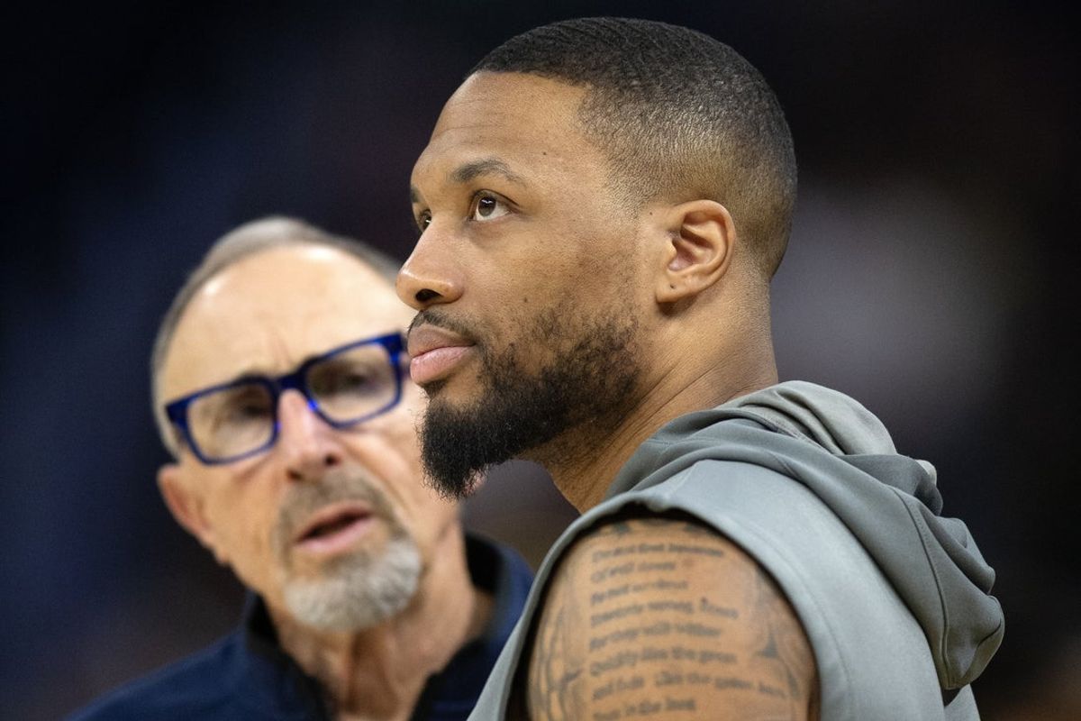 Mar 18, 2025; San Francisco, California, USA; Milwaukee Bucks guard Damian Lillard (right) chats up Golden State Warriors assistant coach Ron Adams before a game at Chase Center. Mandatory Credit: D. Ross Cameron-Imagn Images