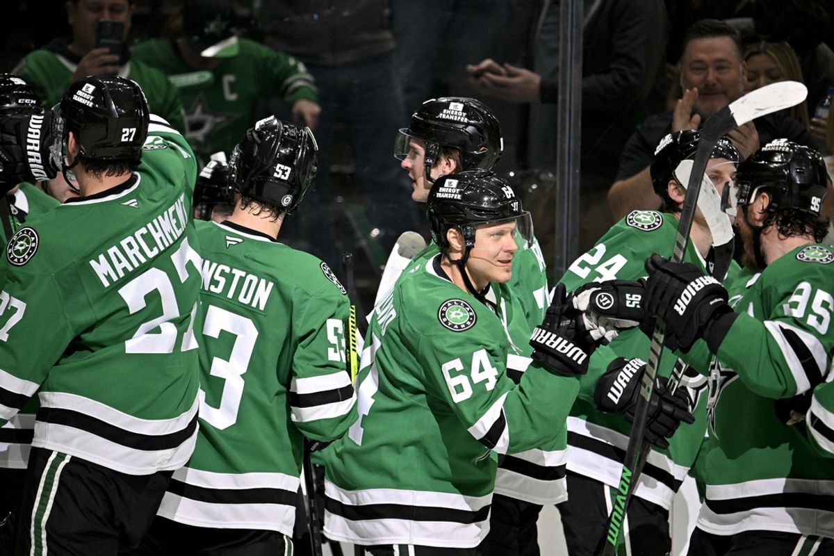 Mar 18, 2025; Dallas, Texas, USA; Dallas Stars center Mikael Granlund (64) and defenseman Thomas Harley (55) and left wing Mason Marchment (27) and center Wyatt Johnston (53) and center Roope Hintz (24) celebrate after Granlund scores the game winning goal over the Anaheim Ducks during the overtime period at the American Airlines Center. Mandatory Credit: Jerome Miron-Imagn Images