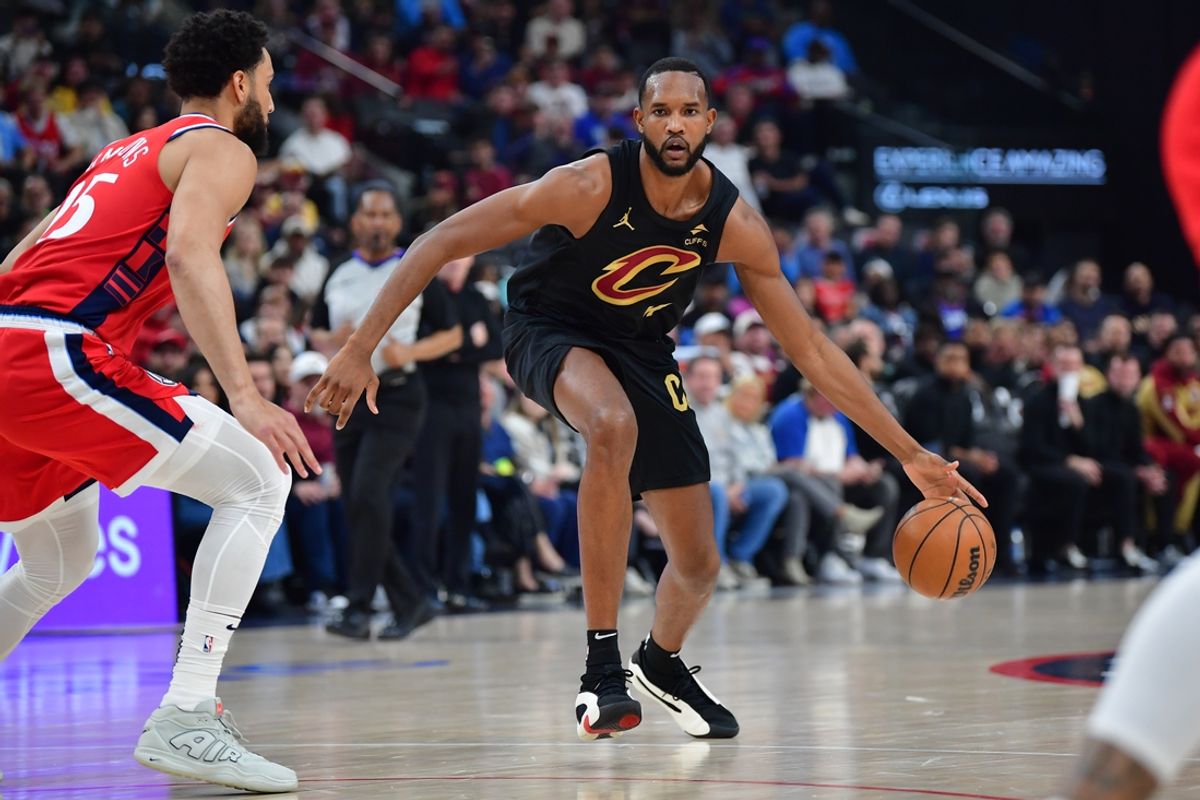 Mar 18, 2025; Inglewood, California, USA;  Cleveland Cavaliers forward Evan Mobley (4) moves the ball against Los Angeles Clippers guard Ben Simmons (25) during the first half at Intuit Dome. Mandatory Credit: Gary A. Vasquez-Imagn Images