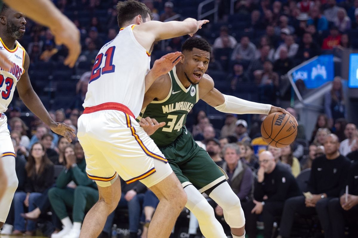 Mar 18, 2025; San Francisco, California, USA; Milwaukee Bucks forward Giannis Antetokounmpo (34) drives around Golden State Warriors center Quinten Post (21) during the first quarter at Chase Center. Mandatory Credit: D. Ross Cameron-Imagn Images