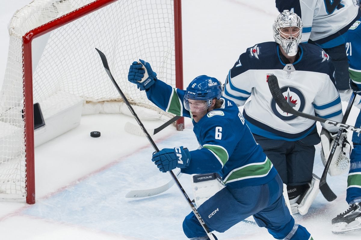 Mar 18, 2025; Vancouver, British Columbia, CAN; Vancouver Canucks forward Brock Boeser (6) celebrates his goal scored on Winnipeg Jets goalie Connor Hellebuyck (37) in the second period at Rogers Arena. Mandatory Credit: Bob Frid-Imagn Images