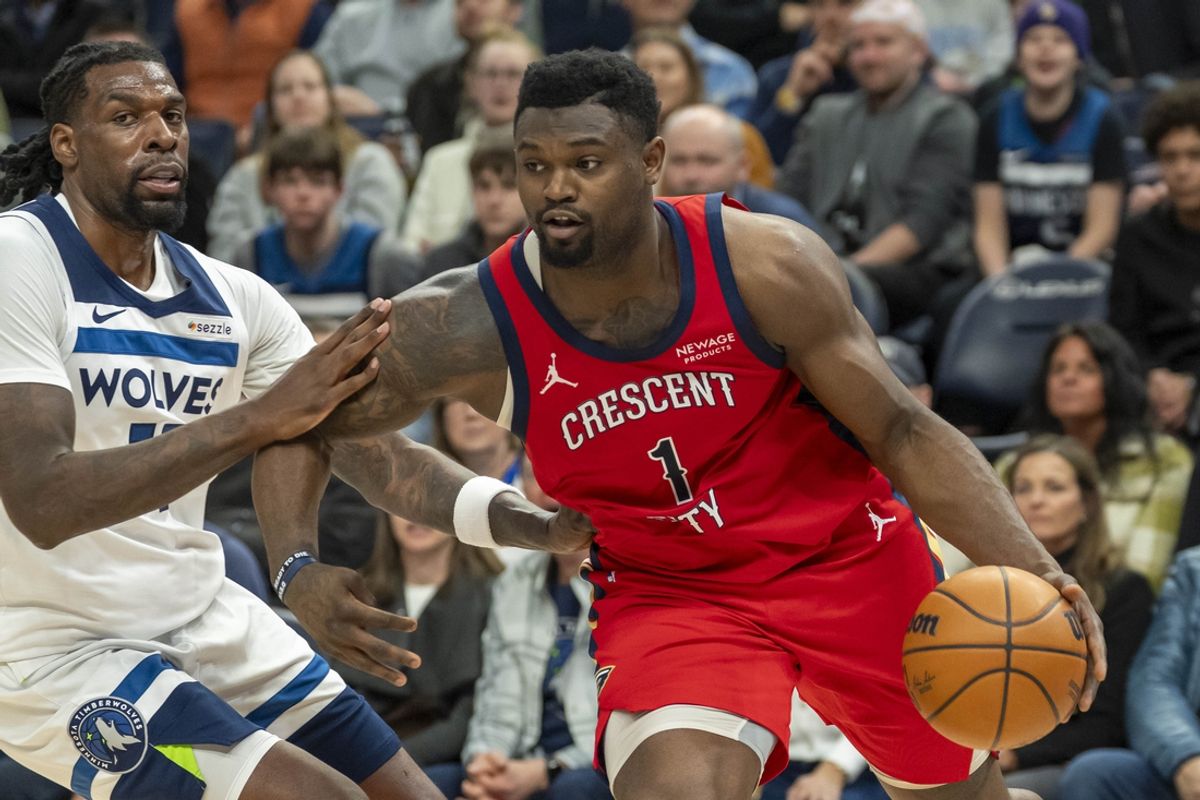 Mar 19, 2025; Minneapolis, Minnesota, USA; New Orleans Pelicans forward Zion Williamson (1) drives to the basket past Minnesota Timberwolves center Naz Reid (11) in the second half at Target Center. Mandatory Credit: Jesse Johnson-Imagn Images