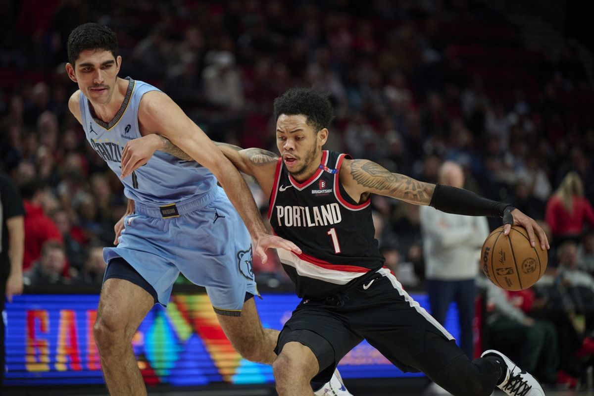 Mar 19, 2025; Portland, Oregon, USA; Portland Trail Blazers guard Anfernee Simons (1) drives to the basket during the second half against Memphis Grizzlies forward Santi Aldama (7) at Moda Center. Mandatory Credit: Troy Wayrynen-Imagn Images