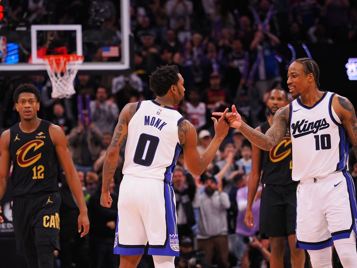 Mar 19, 2025; Sacramento, California, USA; Sacramento Kings guard Malik Monk (0) and forward/guard DeMar DeRozan (10) celebrate after a play against the Cleveland Cavaliers during the fourth quarter at Golden 1 Center. Mandatory Credit: Kelley L Cox-Imagn Images