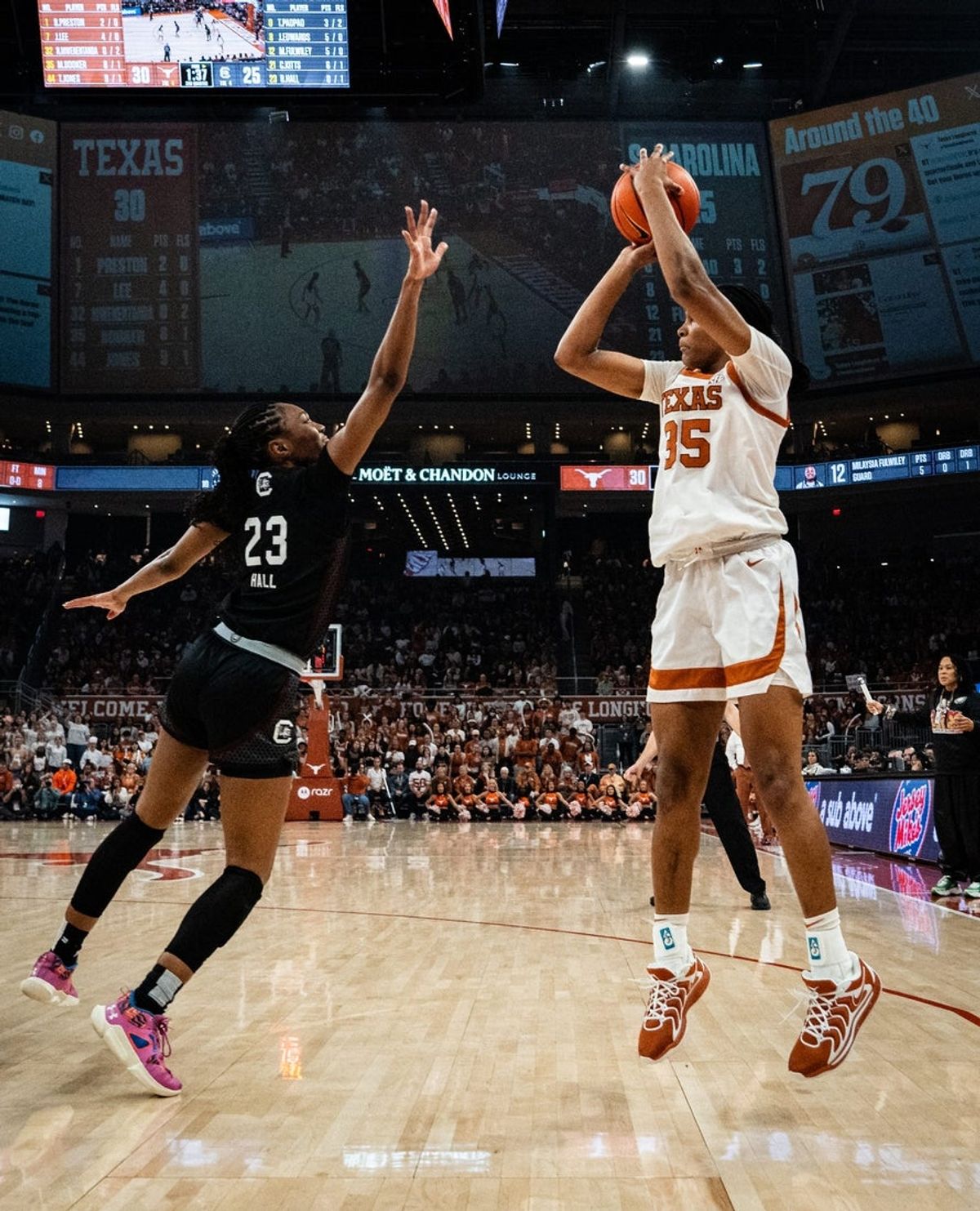 Texas Longhorns forward Madison Booker (35) puts up a 3-point shot over South Carolina Gamecocks guard Bree Hall (23) in the first half as the Texas Longhorns take on the South Carolina Gamecocks at the Moody Center, Feb. 9, 2025.