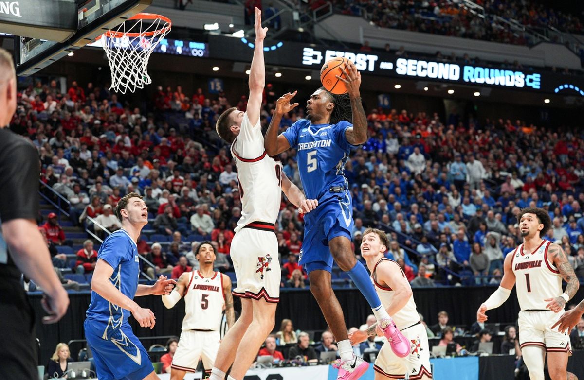 Creighton Bluejays guard Jamiya Neal (5) looks to score against Louisville Cardinals forward Noah Waterman (93) during the 2025 NCAA men's basketball tournament at Rupp Arena in Lexington, Kentucky Thursday March 20, 2025.