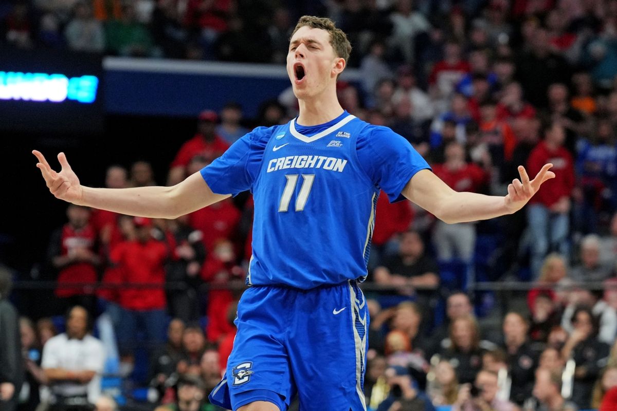 Mar 20, 2025; Lexington, KY, USA; Creighton Bluejays center Ryan Kalkbrenner (11) celebrate after making a three pointer during the second half against the Louisville Cardinals in the first round of the NCAA Tournament at Rupp Arena. Mandatory Credit: Aaron Doster-Imagn Images