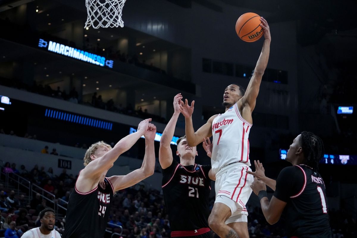 Mar 20, 2025; Wichita, KS, USA; Houston Cougars guard Milos Uzan (7) shoots against SIU Edwardsville Cougars center Arnas Sakenis (34), forward Myles Thompson (21) and guard Jordan Pickett (1) in the first half of a first round men’s NCAA Tournament game at Intrust Bank Arena. Mandatory Credit: Kirby Lee-Imagn Images