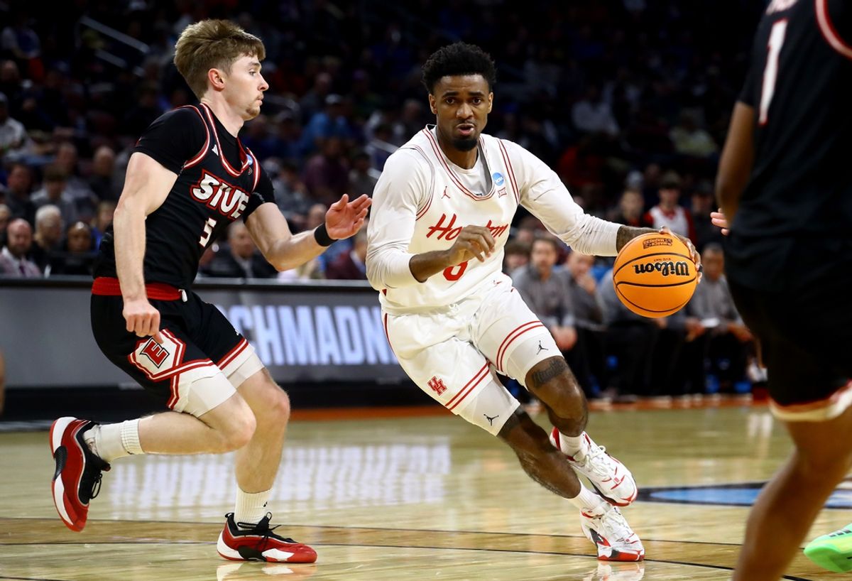 Mar 20, 2025; Wichita, KS, USA; Houston Cougars guard Mylik Wilson (8) dribbles against SIU Edwardsville Cougars guard Declan Dillon (5) in the second half of a first round men’s NCAA Tournament game at Intrust Bank Arena. Mandatory Credit: Nick Tre. Smith-Imagn Images
