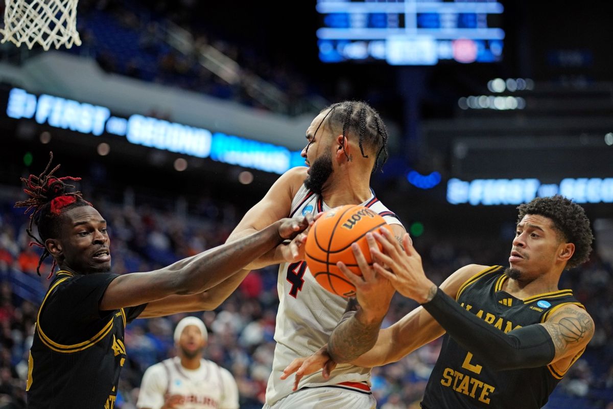 Mar 20, 2025; Lexington, KY, USA;  Auburn Tigers forward Johni Broome (4) goes for the ball against Alabama State Hornets guard Micah Simpson (2) during the second half in the first round of the NCAA Tournament at Rupp Arena. Mandatory Credit: Aaron Doster-Imagn Images