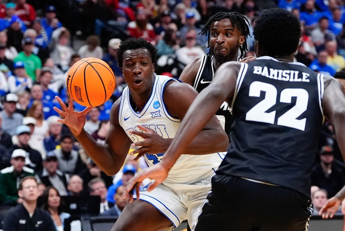 Mar 20, 2025; Denver, CO, USA; Brigham Young Cougars center Fousseyni Traore (45) looses the ball against the VCU Rams during the first half in the first round of the NCAA Tournament at Ball Arena. Mandatory Credit: Ron Chenoy-Imagn Images