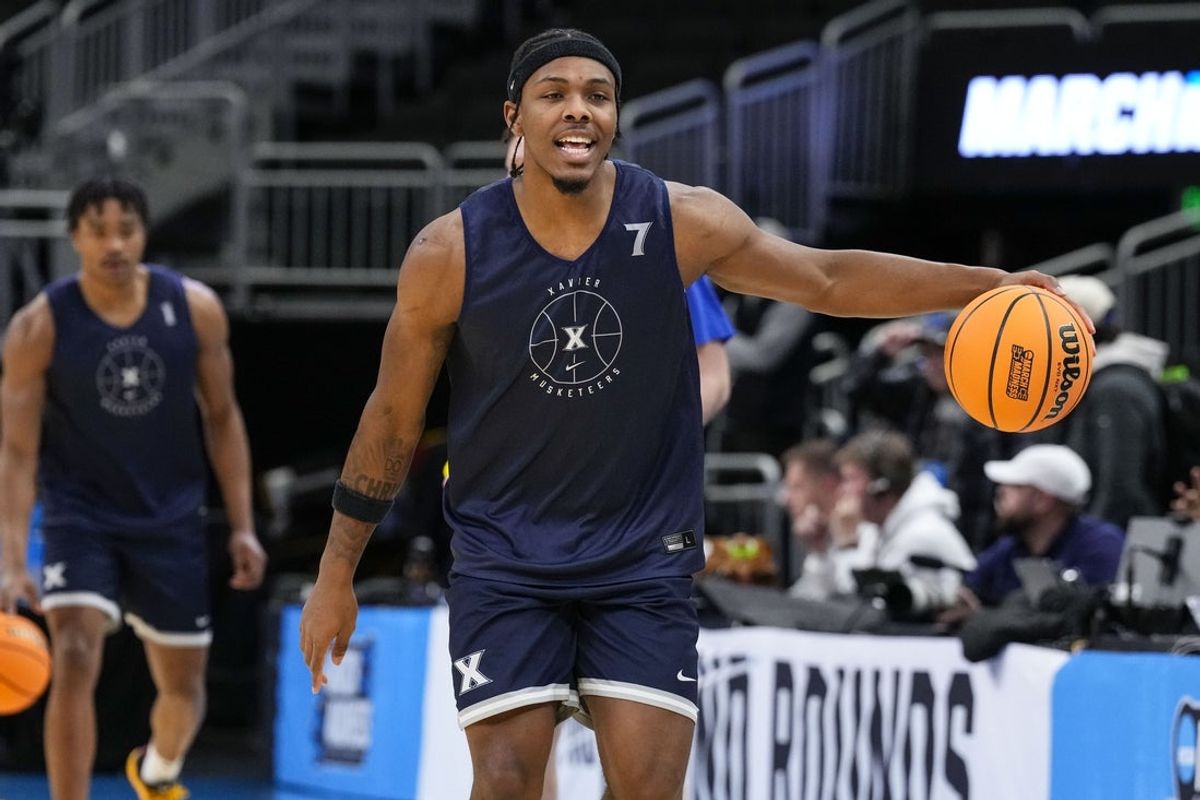 Mar 20, 2025; Milwaukee, WI, USA;  Xavier Musketeers guard Ryan Conwell (7) dribbles the ball during NCAA Tournament First Round Practice at Fiserv Forum. Mandatory Credit: Jeff Hanisch-Imagn Images