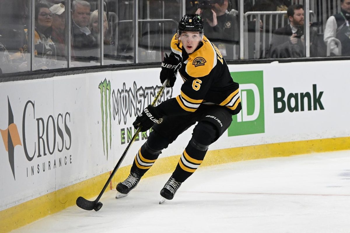 Mar 15, 2025; Boston, Massachusetts, USA; Boston Bruins defenseman Mason Lohrei (6) with the puck during the second period against the Tampa Bay Lightning at TD Garden. Mandatory Credit: Eric Canha-Imagn Images