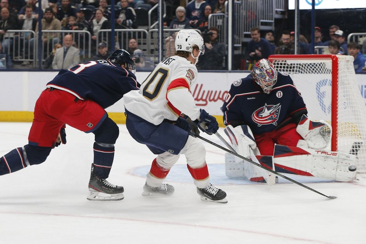 Mar 20, 2025; Columbus, Ohio, USA; Columbus Blue Jackets goalie Elvis Merzlikins (90) makes a save on the shot from Florida Panthers left wing A.J. Greer (10) during the first period at Nationwide Arena. Mandatory Credit: Russell LaBounty-Imagn Images