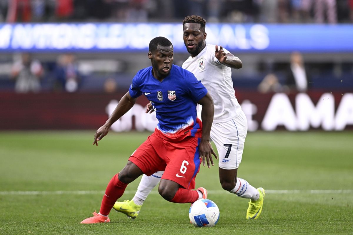Mar 20, 2025; Inglewood, California, USA; United States of America midfielder Yunus Musah (6) kicks the ball past Panama midfielder Jose Rodriguez (7) in the first half during a Concacaf Nations League semifinal match at SoFi Stadium. Mandatory Credit: Alex Gallardo-Imagn Images