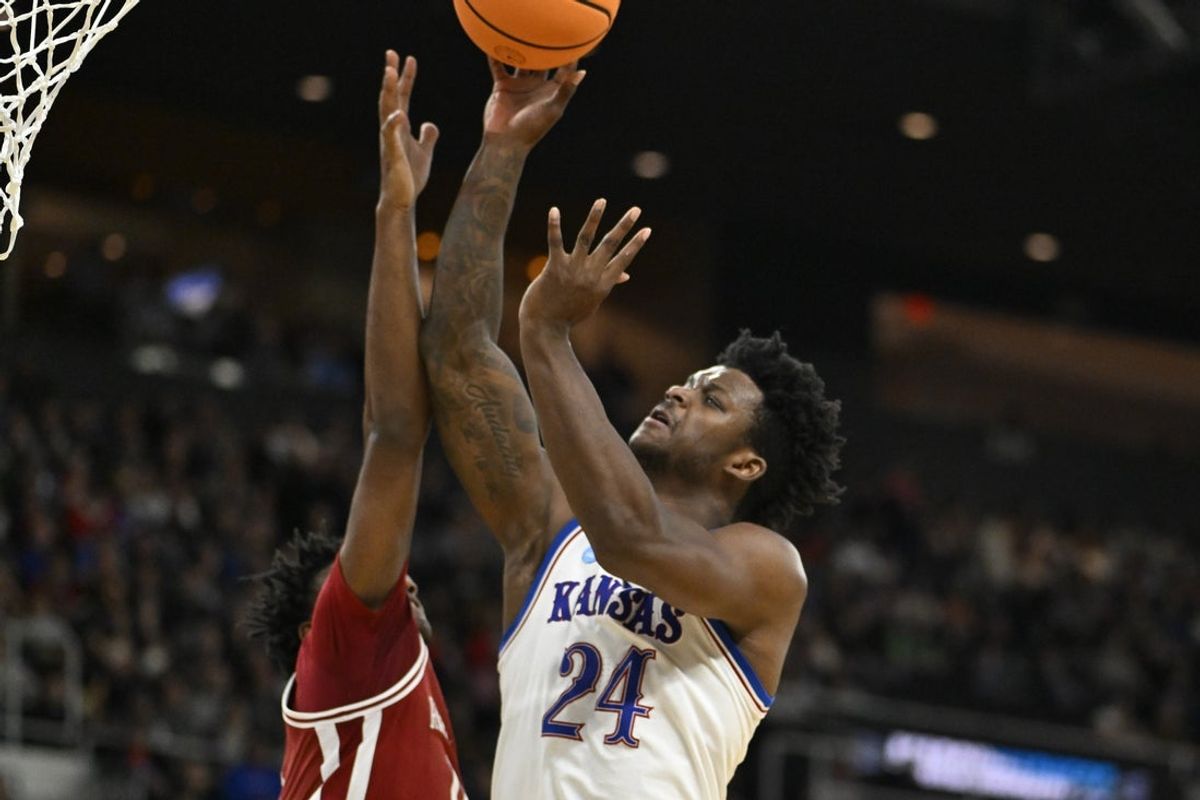 Mar 20, 2025; Providence, RI, USA;  Kansas Jayhawks forward KJ Adams Jr. (24) shoots the ball during the first half against the Arkansas Razorbacks at Amica Mutual Pavilion. Mandatory Credit: Eric Canha-Imagn Images