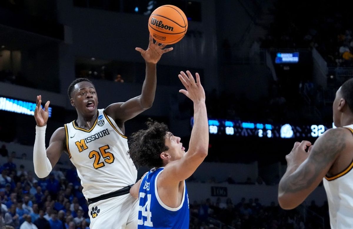 Mar 20, 2025; Wichita, KS, USA; Missouri Tigers guard Mark Mitchell (25) passes against Drake Bulldogs forward Daniel Abreu (54) in the first half of a first round men’s NCAA Tournament game at Intrust Bank Arena. Mandatory Credit: Kirby Lee-Imagn Images