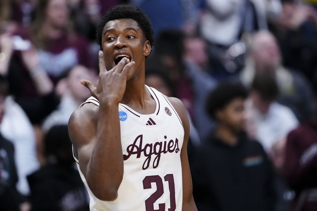 March 20, 2025; Denver, CO, USA; Texas A&M Aggies forward Pharrel Payne (21) reacts after the win over Yale Bulldogs at Ball Arena. Mandatory Credit: Ron Chenoy-Imagn Images