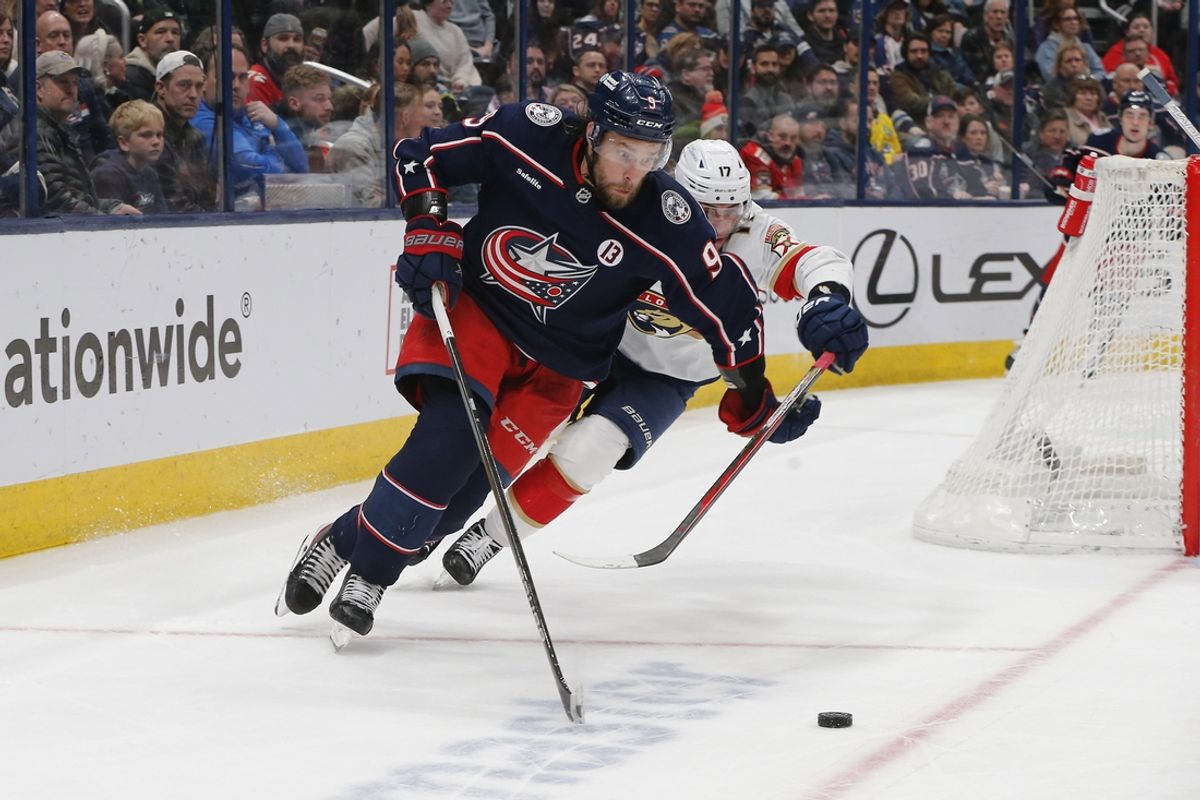 Mar 20, 2025; Columbus, Ohio, USA; Columbus Blue Jackets defenseman Ivan Provorov (9) carries the puck as Florida Panthers center Evan Rodrigues (17) trails the play during the third period at Nationwide Arena. Mandatory Credit: Russell LaBounty-Imagn Images