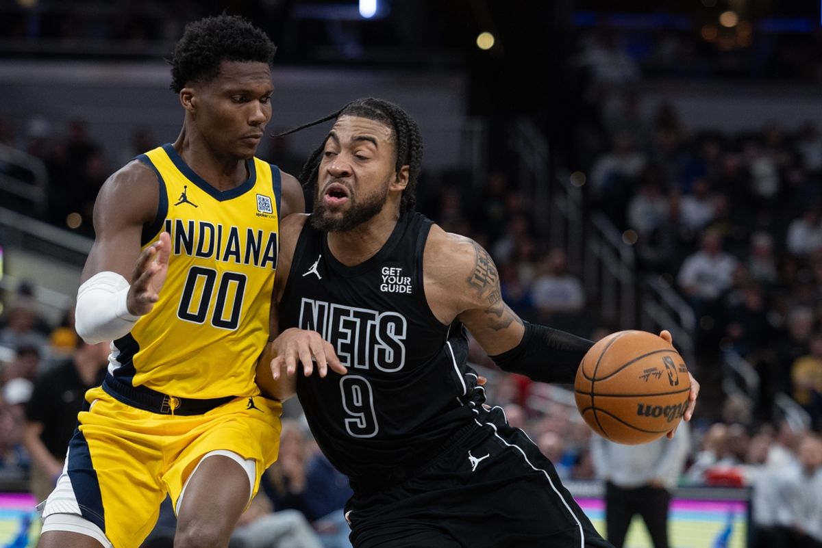 Mar 20, 2025; Indianapolis, Indiana, USA; Brooklyn Nets forward Trendon Watford (9) dribbles the ball while Indiana Pacers guard Bennedict Mathurin (00) defends in the second half at Gainbridge Fieldhouse. Mandatory Credit: Trevor Ruszkowski-Imagn Images