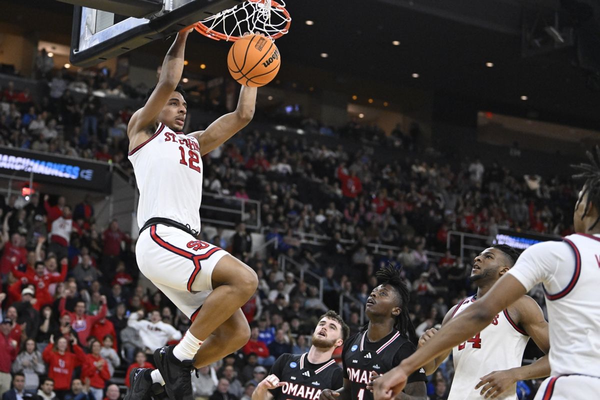 Mar 20, 2025; Providence, RI, USA;  St. John's Red Storm guard RJ Luis Jr. (12) puts up a basket during the second half against the Omaha Mavericks at Amica Mutual Pavilion. Mandatory Credit: Eric Canha-Imagn Images