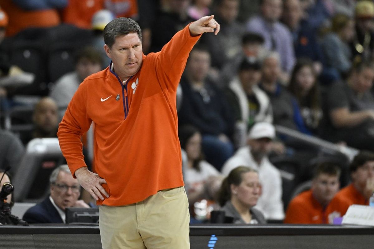 Mar 20, 2025; Providence, RI, USA; Clemson Tigers head coach Brad Brownell signals to his players during the first half against the McNeese State Cowboys at Amica Mutual Pavilion. Mandatory Credit: Eric Canha-Imagn Images