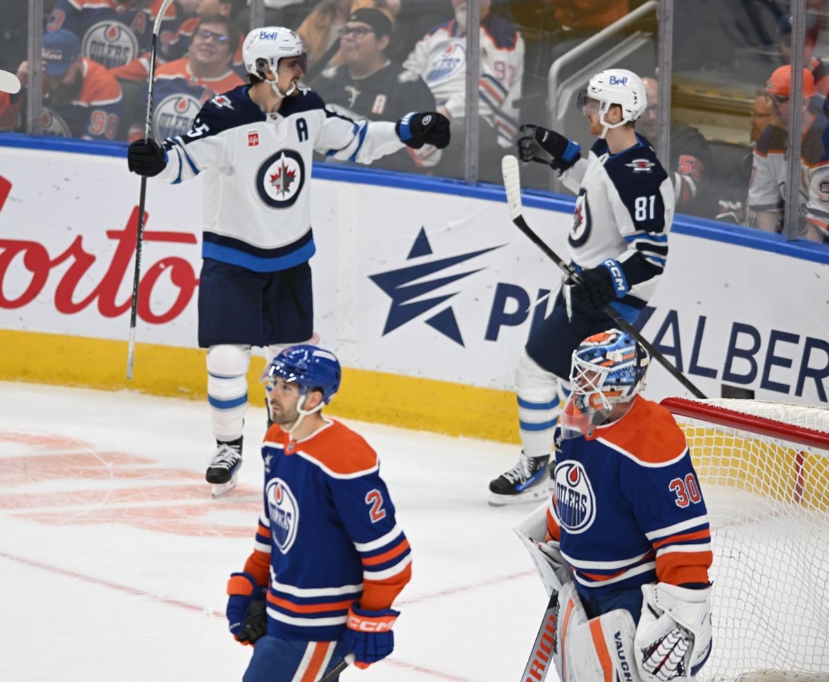Mar 20, 2025; Edmonton, Alberta, CAN; Winnipeg Jets center Mark Scheifele (55) and Jets left wingwer Kyle Connor (81) celebrate their win on the Edmonton Oilers during the overtime period at Rogers Place. Mandatory Credit: Walter Tychnowicz-Imagn Images