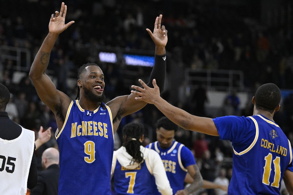 Mar 20, 2025; Providence, RI, USA;  McNeese State Cowboys forward Christian Shumate (24) celebrates with guard Quadir Copeland (11) after defeating the Clemson Tigers at Amica Mutual Pavilion. Mandatory Credit: Eric Canha-Imagn Images