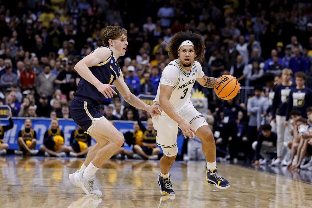 March 20, 2025; Denver, CO, USA; Michigan Wolverines guard Tre Donaldson (3) dribbles the ball during the second half as UC San Diego Tritons guard Hayden Gray (3) defends at Ball Arena. Mandatory Credit: Isaiah J. Downing-Imagn Images