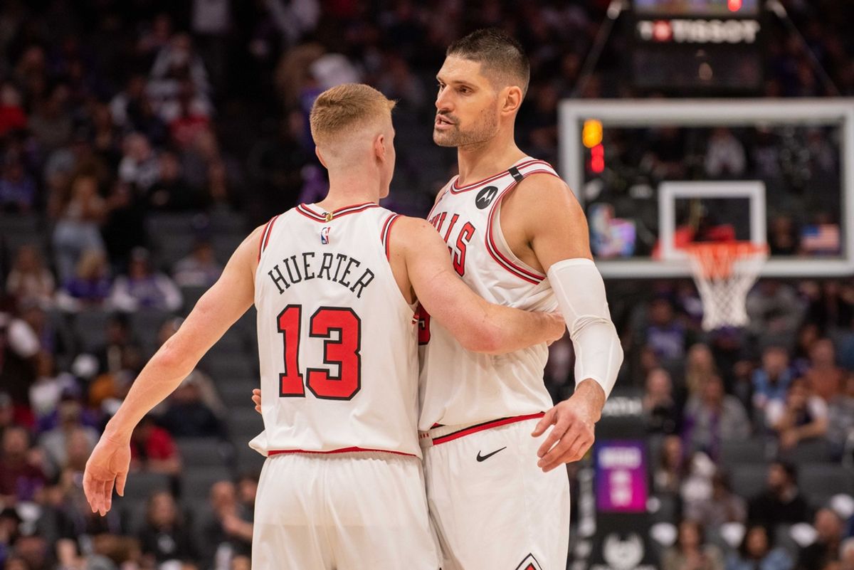 Mar 20, 2025; Sacramento, California, USA; Chicago Bulls guard Kevin Huerter (13) and center Nikola Vucevic (9) celebrate after defeating the Sacramento Kings at Golden 1 Center. Mandatory Credit: Ed Szczepanski-Imagn Images