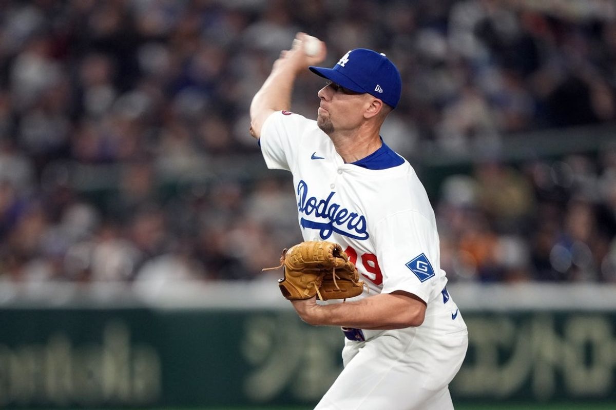 Mar 15, 2025; Bunkyo, Tokyo, Japan; Los Angeles Dodgers pitcher Blake Treinen (49) throws a pitch against the Yomiuri Giants during the seventh inning at Tokyo Dome. Mandatory Credit: Darren Yamashita-Imagn Images