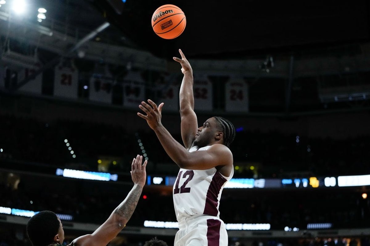Mar 21, 2025; Raleigh, NC, USA; Mississippi State Bulldogs guard Josh Hubbard (12) shoots the ball against the Baylor Bears during the second half in the first round of the NCAA Tournament at Lenovo Center. Mandatory Credit: Bob Donnan-Imagn Images