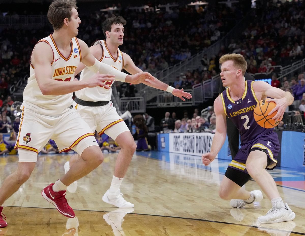 Lipscomb guard Will Pruitt (2) is double-teamed by Iowa State forward Brandton Chatfield (33) and forward Milan Momcilovic (22) during the first half of their first round NCAA men’ s basketball tournament game Friday, March 21, 2025 at Fiserv Forum in Milwaukee, Wisconsin. Momcilovic is from Pewaukee, Wisconsin.