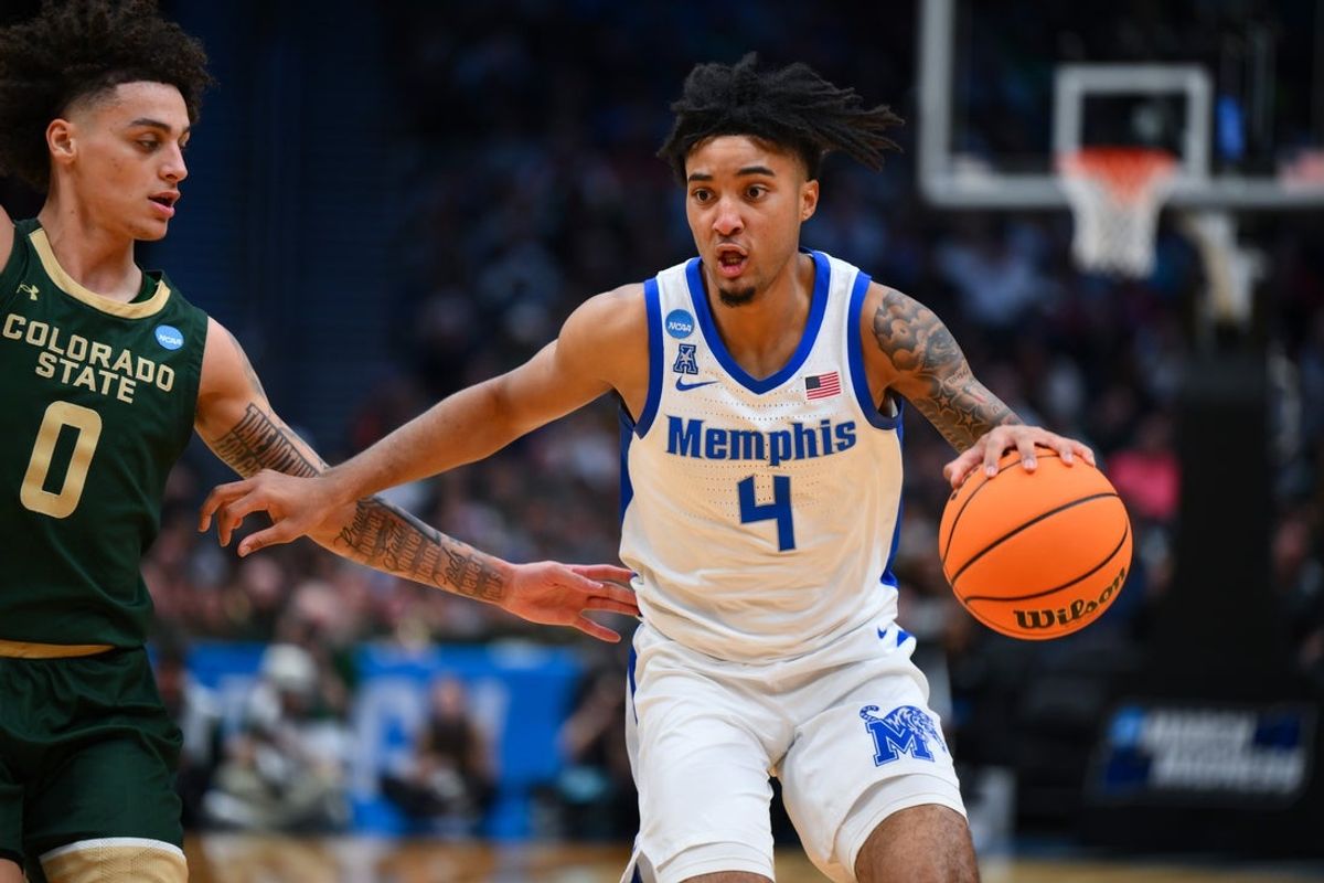 Mar 21, 2025; Seattle, WA, USA; Memphis Tigers guard PJ Haggerty (4) drives the ball during the second half against Colorado State Rams at Climate Pledge Arena. Mandatory Credit: Steven Bisig-Imagn Images