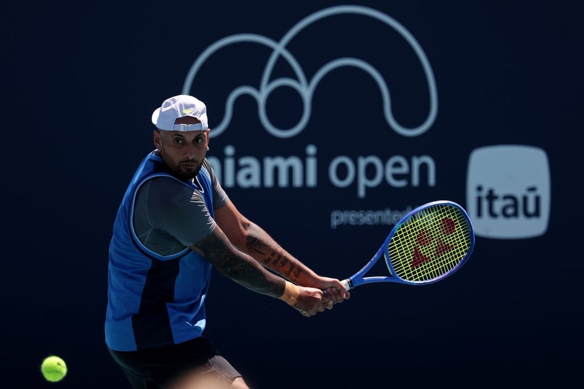 Mar 21, 2025; Miami, FL, USA; Nick Kyrgios (AUS) hits a backhand against Karen Khachanov (not pictured) on day four of the Miami Open at Hard Rock Stadium. Mandatory Credit: Geoff Burke-Imagn Images