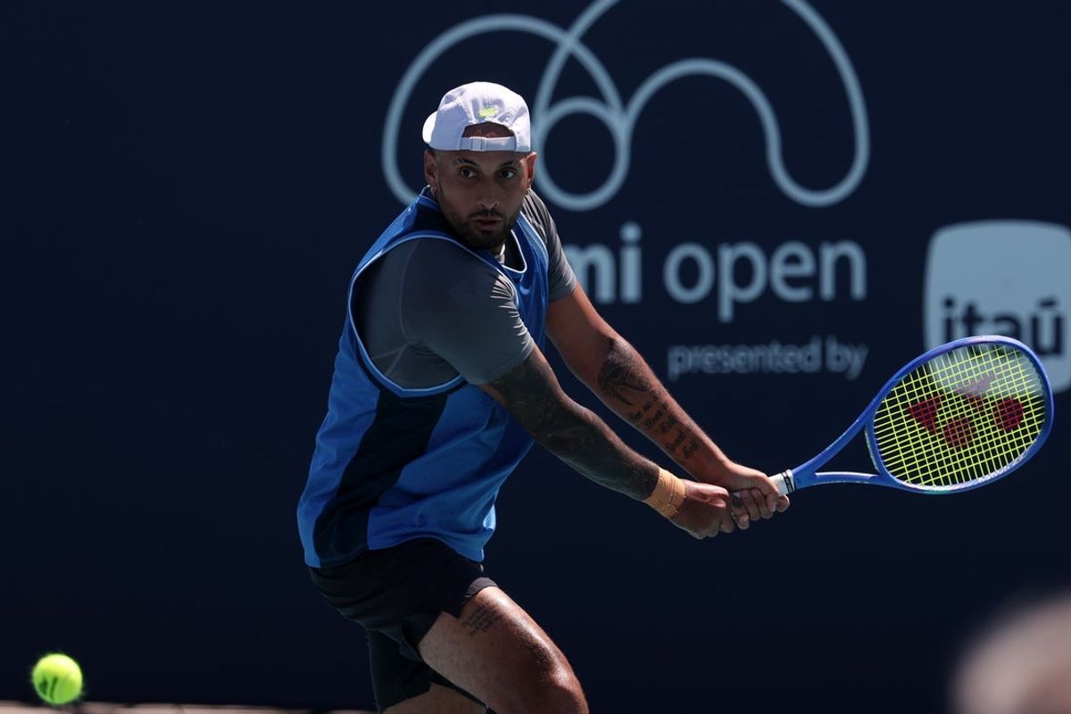 Mar 21, 2025; Miami, FL, USA; Nick Kyrgios (AUS) hits a backhand against Karen Khachanov (not pictured) on day four of the Miami Open at Hard Rock Stadium. Mandatory Credit: Geoff Burke-Imagn Images