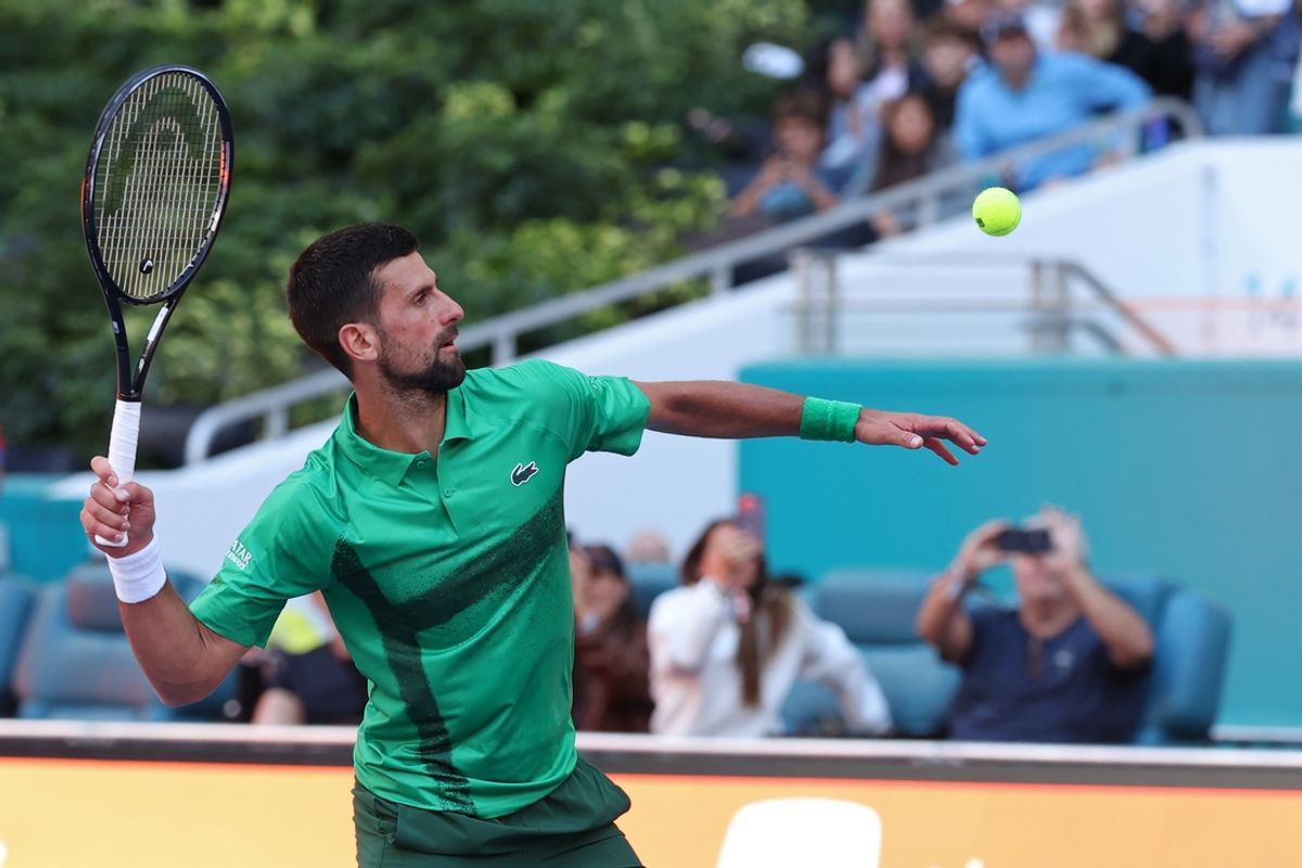 Mar 21, 2025; Miami, FL, USA; Novak Djokovic (SRB) hits a ball into the crowd in celebration after his match against Rinky Hijikata (AUS)(not pictured) on day four of the Miami Open at Hard Rock Stadium. Mandatory Credit: Geoff Burke-Imagn Images
