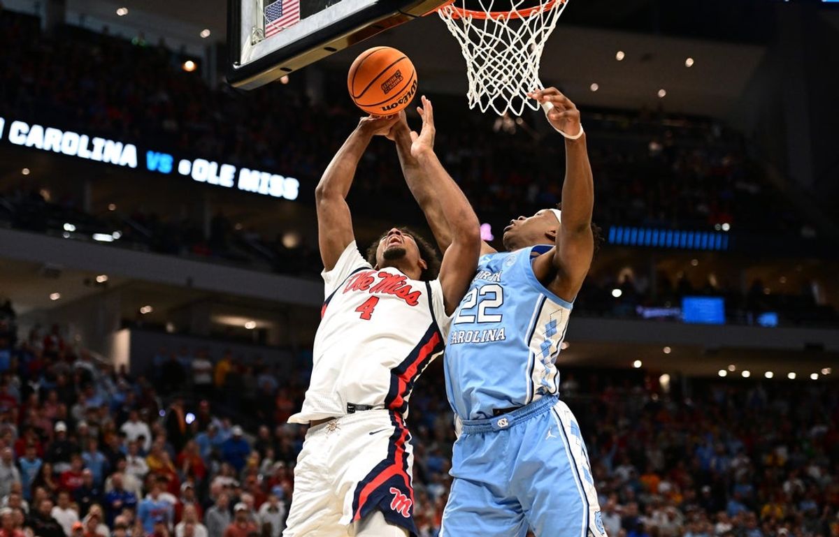Mar 21, 2025; Milwaukee, WI, USA; Mississippi Rebels forward Jaemyn Brakefield (4) shoots against North Carolina Tar Heels forward Ven-Allen Lubin (22) during the second half of a first round NCAA men’s tournament game at Fiserv Forum. Mandatory Credit: Benny Sieu-Imagn Images