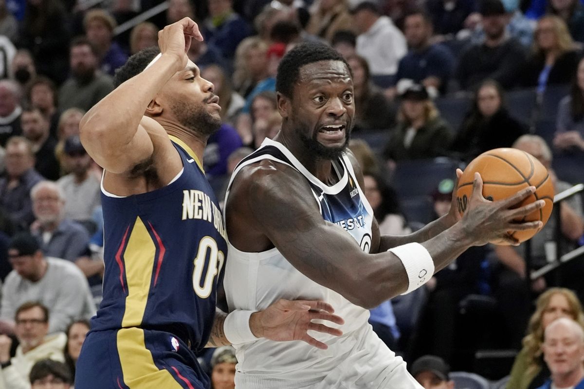 Mar 21, 2025; Minneapolis, Minnesota, USA; Minnesota Timberwolves forward Julius Randle (30) works around New Orleans Pelicans guard Bruce Brown (00) in the first quarter at Target Center. Mandatory Credit: Bruce Kluckhohn-Imagn Images
