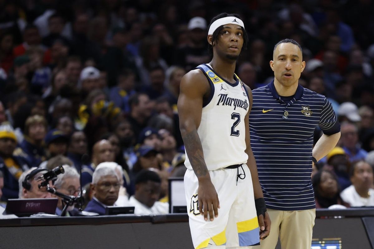 Mar 21, 2025; Cleveland, OH, USA; Marquette Golden Eagles guard Chase Ross (2) talks with head coach Shaka Smart in the second half against the New Mexico Lobos during the NCAA Tournament First Round at Rocket Arena. Mandatory Credit: Rick Osentoski-Imagn Images